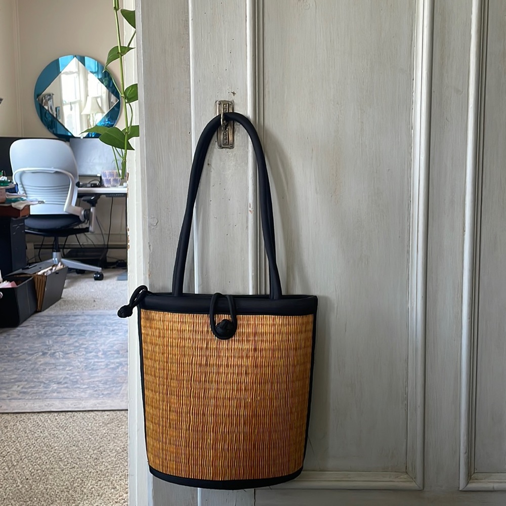 Baskets of Cambodia ergonomic woven straw grass curved Dabby purse